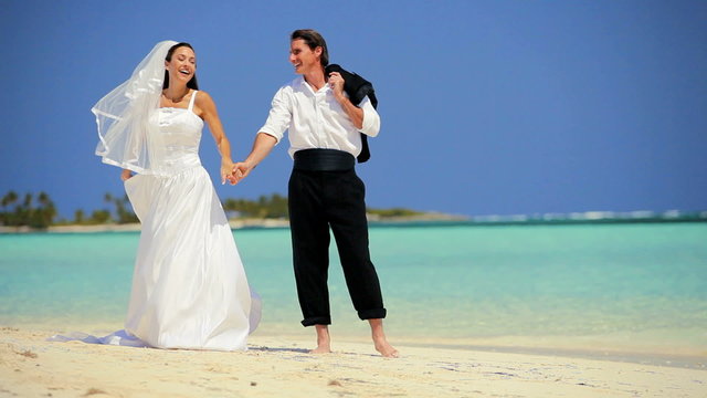 Wedding Couple Laughing & Dancing on the Beach