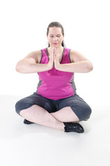 Fototapeta premium Übergewichtige erwachsene Frau macht Yoga
