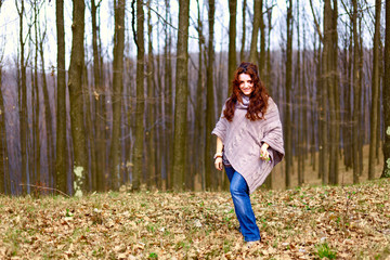 Young woman in a beech forest
