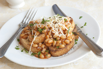 Toast with baked beans and grated cheese