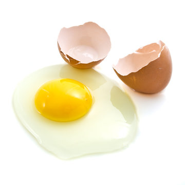 Broken raw egg isolated on white background