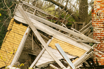 dilapidated wooden house fallen into ruin