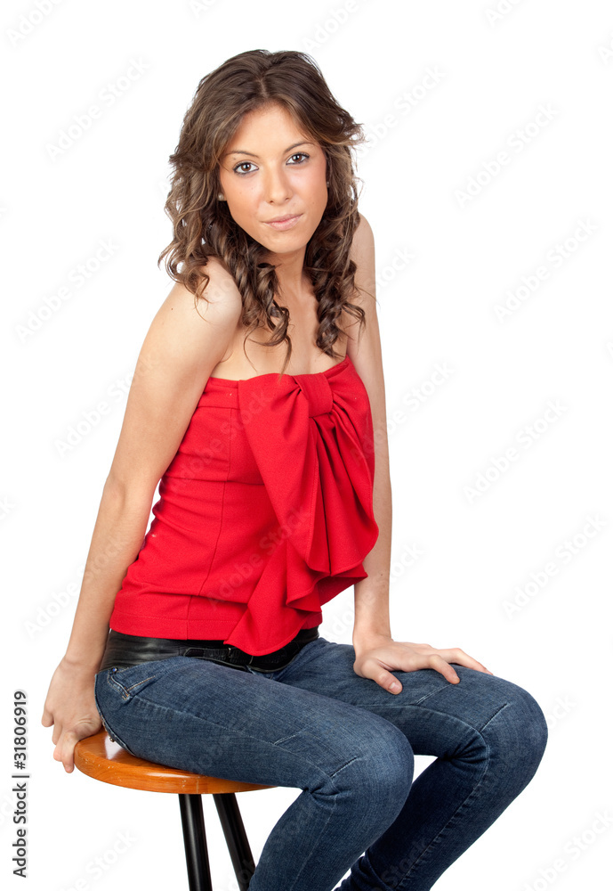 Wall mural Beautiful girl sitting o a stool