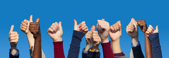 Multiracial Thumbs Up Against Blue Sky - obrazy, fototapety, plakaty