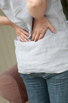 Closeup on senior woman with backache