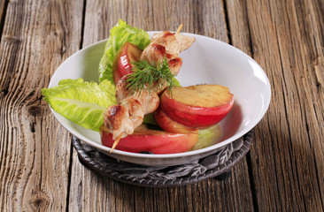 Chicken skewer and baked apple