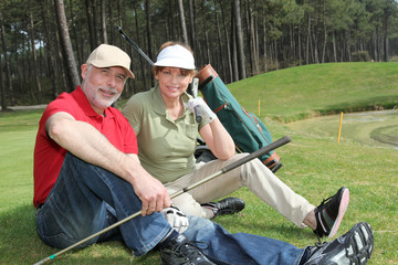 Senior people sitting on golf course