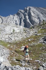 Fototapeta na wymiar Female Hiker On Rocky Trail, Kananaskis Country, Alberta, Canada