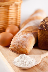 bread, flour, eggs and kitchen utensil