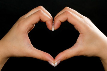 Heart shape formed by female hands