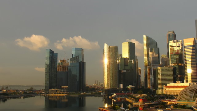 Time lapse Singapore skyline at sunrise. Pan movement.