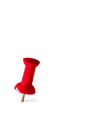red thumbtack over white background
