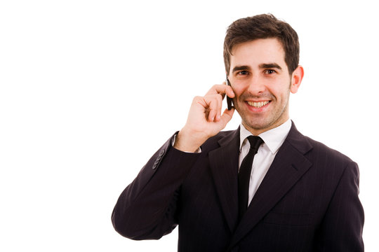 Smiling young business man on the phone, isolated on white