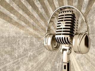 Microphone with headphones on the old background