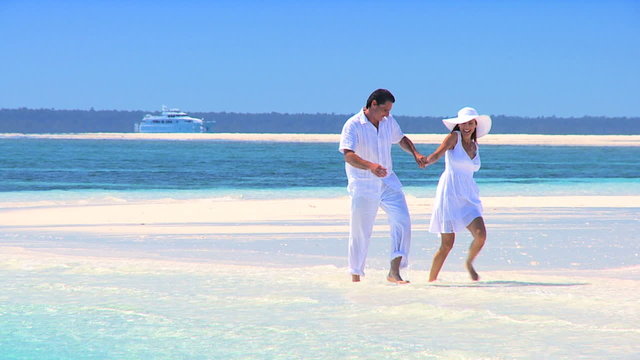 Happy Couple on Beautiful White Sand Beach
