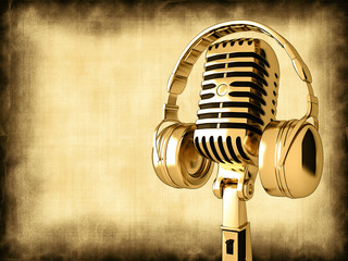 Microphone with headphones on old background
