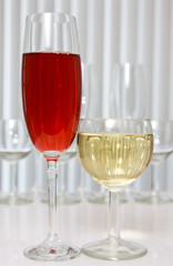 glass of red and white wine on  the table