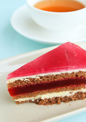 Slice cake with tea cup