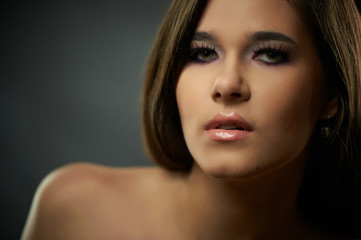 Fototapeta premium Closeup portrait of young beautiful woman