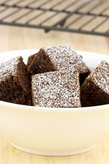 chocolate brownies with powdered sugar on top