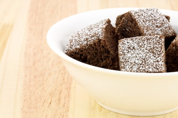 chocolate brownies with powdered sugar on top