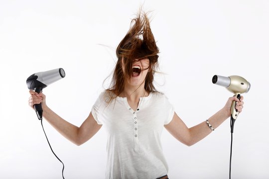 young beauty with two hairdryer