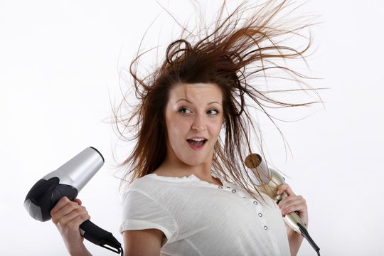 young beauty with two hairdryer