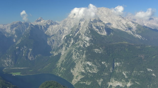 Time lapse clouds Mt. Watzmann. Ships on Koenigssee.