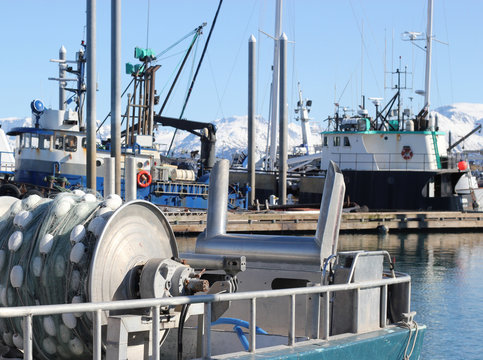Fototapeta Commercial fishing boat with a net reel in the harbor