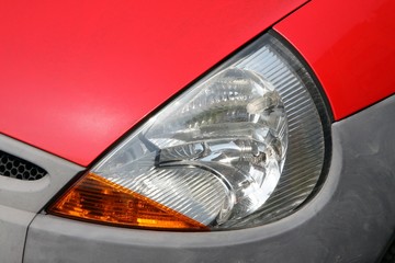 headlamp of red car © rafalwit