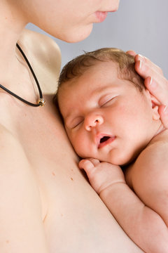 picture of  mother with slepping baby over white