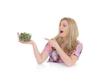 Casual woman eating healthy green vegetable salad. isolated on w