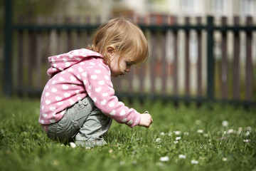 Little girl outside on lawn