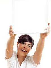 Smiling woman holding sign or board over her head