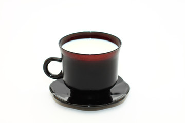 Cup of milk on white background