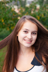 Fototapeta premium portrait of a beautiful young woman outdoor