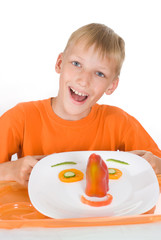 boy holding a plate
