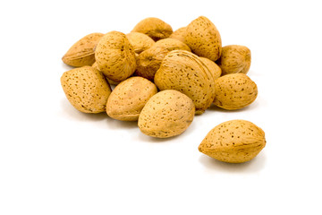 Almond pile macro isolated on white