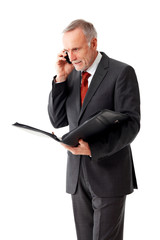 Mature business man with folder, phoning