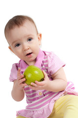 Baby girl in pink eating apple