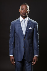 Serious business man wearing suit and tie. Isolated.