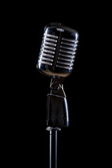 Fototapeta premium Microphone isolated on black background