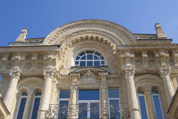 Fototapeta premium architectural building with columns, railings and arched windows