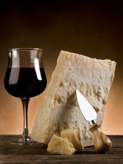 parmesan cheese and glass of red wine