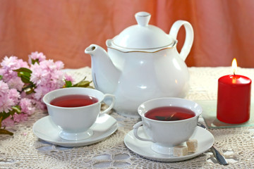 Healthy fruit Tea in a cup and teapot