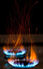flames over gas stove