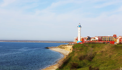 Fototapeta na wymiar Beautiful lighthouse on sea coast