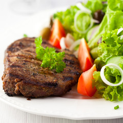 Grilled steak with salad