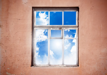 Closed window with cloud landscape.