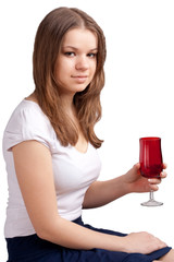 A girl in a bright red T-shirt and a glass